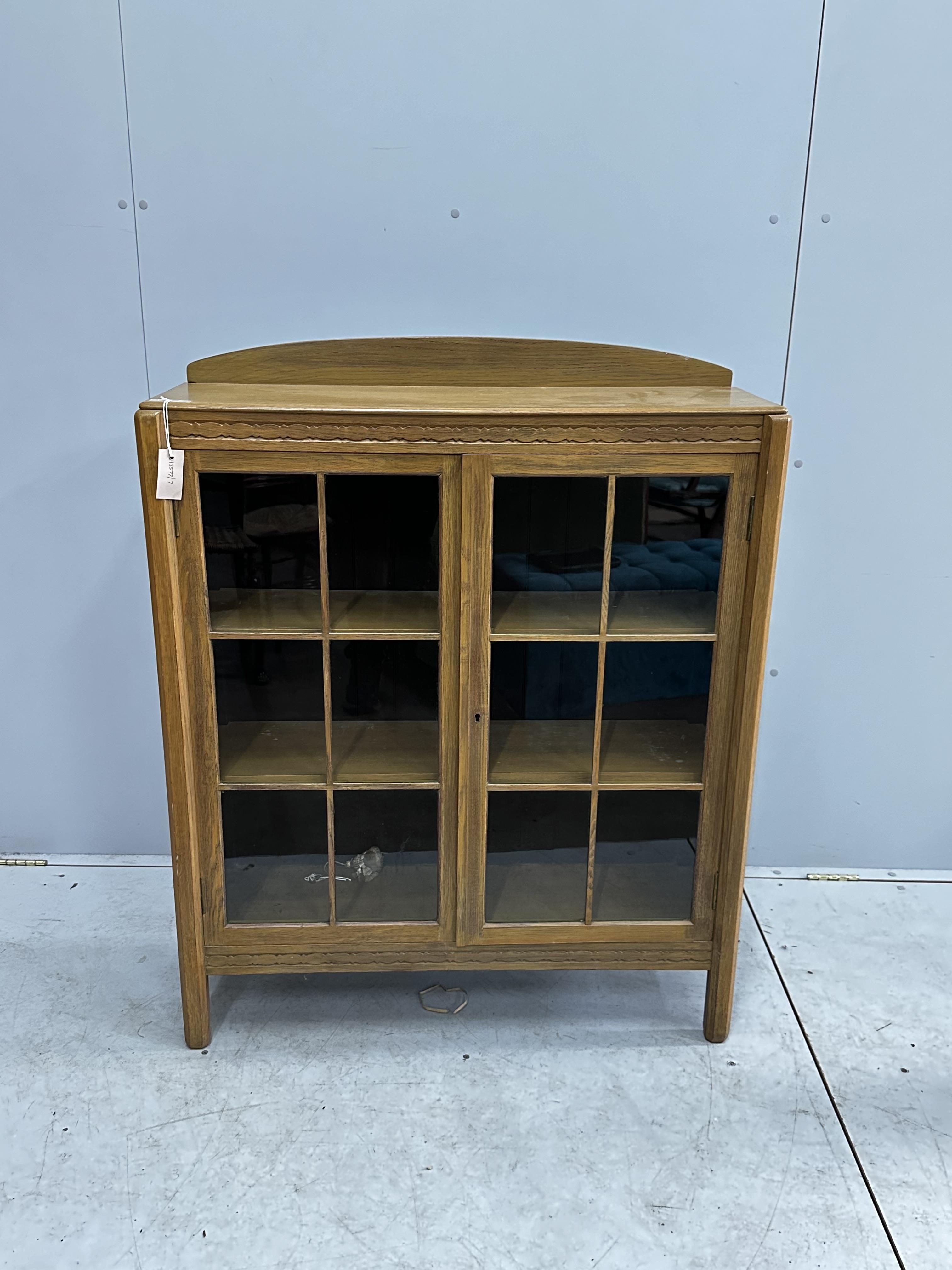 An early 20th century bleached oak glazed bookcase, width 91cm, depth 28cm, height 114cm